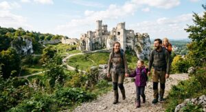 A high-quality, editorial-style photograph of a picturesque medieval castle ruin on the Eagle's Nest