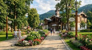 A professional, editorial-style photograph of a picturesque, sun-drenched historic spa park in Lesse